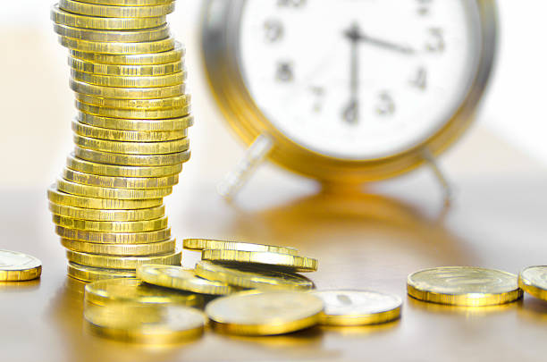istock Alarm clock and money 501336161