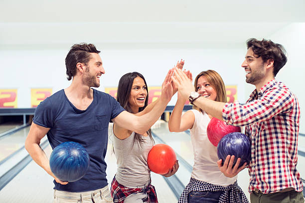 istock Cheerful Friends Bowling Together. 501338047