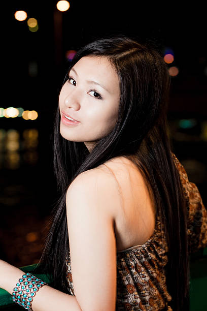 istock Asian Girl Looking over Shoulder 501338116