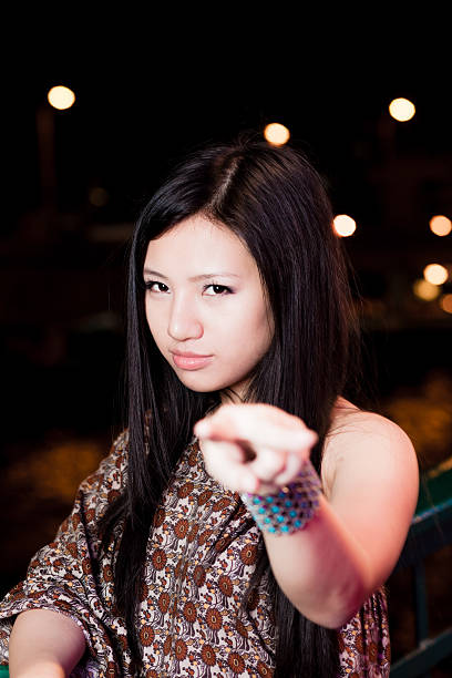 istock Asian Girl gesturing to the camera 501338166