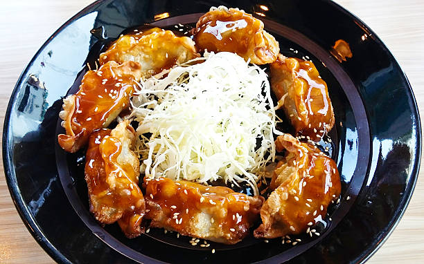 istock Fried dumplings serve with chopped cabbage, Japanese food 501338436