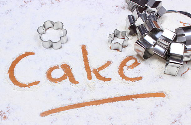 istock Word cake written in flour and cookie cutters 501341140