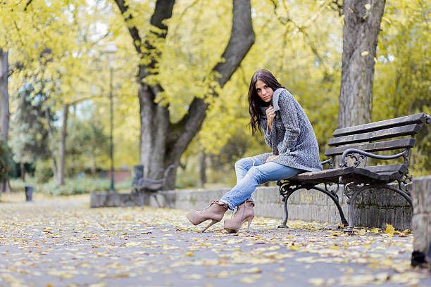 istock Young woman at autumn park 501342037
