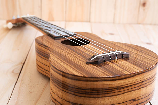 istock Ukulele on wooden background 501343326