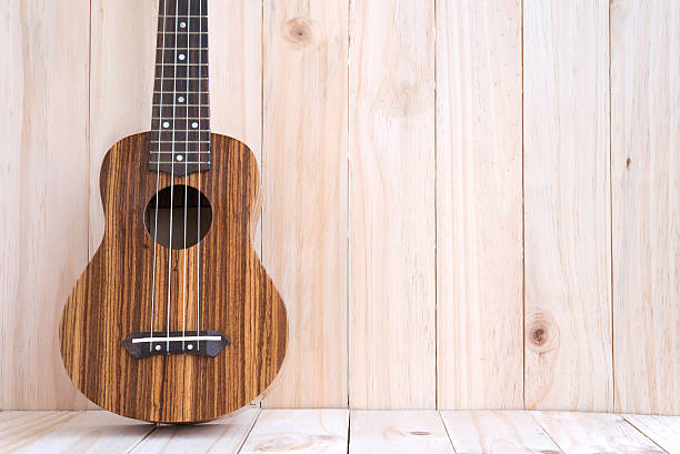 istock Ukulele on wooden background 501343642