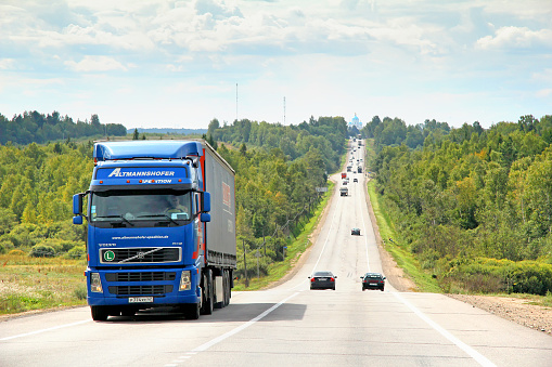 Vladimir region, Russia - August 26, 2011: Blue semi-trailer truck Volvo FH12 drives at the interurban freeway.