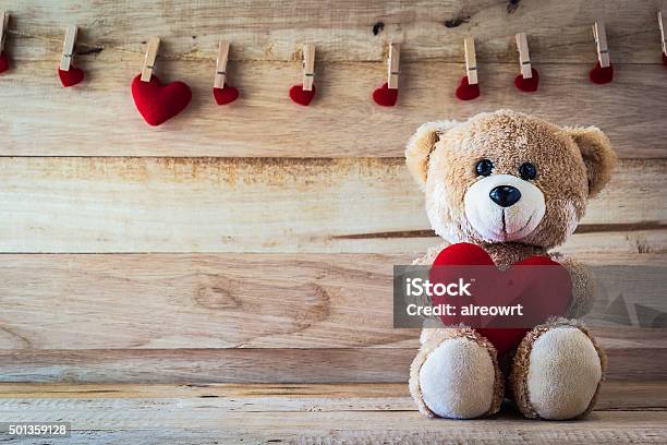 Teddy Bear Holding A Heartshaped Pillow Stock Photo - Download Image Now - Heart Shape, Teddy Bear, 2015