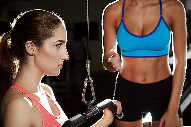 istock Staying in top form with the help of her instructor 501359542