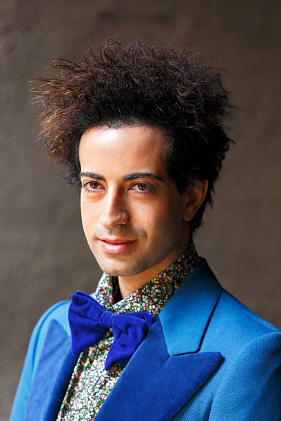 istock Stylish, trendy guy with crazy hair and bow tie 501360495