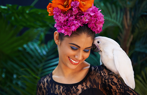 Shot of an exotic looking woman with a parrot perched on her handhttp://195.154.178.81/DATA/i_collage/pi/shoots/783575.jpg