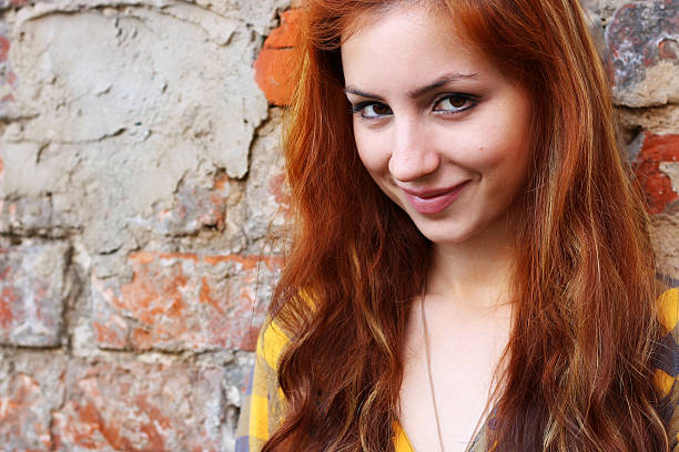 istock red-haired girl in a hat hipster 501360636