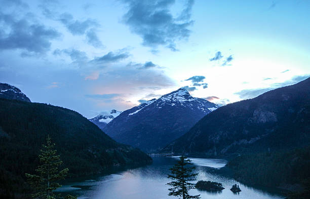 istock Sunset over snowcapped mountain with river between two hills 501361096