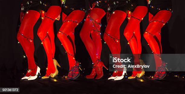 New Year Dancing Composition Of Seducing Women Legs Garland Illumination Stock Photo - Download Image Now