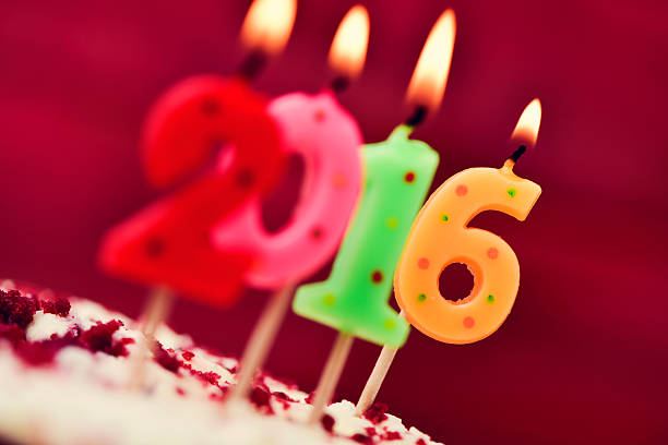 istock lit number-shaped candles forming number 2016 on a cake 501361486