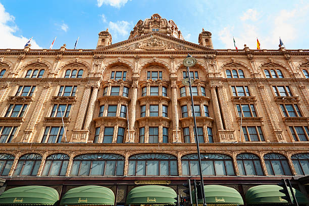 Harrods building facade in London London, UK - August 7, 2014: The famous Harrods department store building facade in a summer afternoon in London, UK. harrods photos stock pictures, royalty-free photos & images