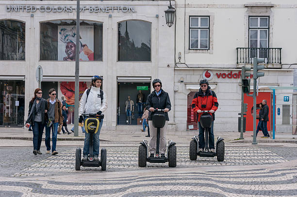 Tourist group having guided Segway city tour in Lisbon stock photo