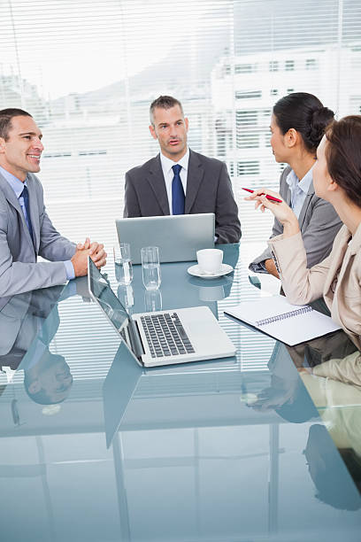 istock Concentrated business people working together over coffee 501362101
