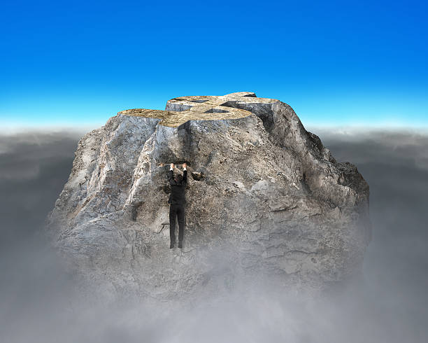istock Trying to climb on money symbol shape rocky mountain 501363365