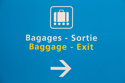 Baggage claim and exit sign in Paris airport