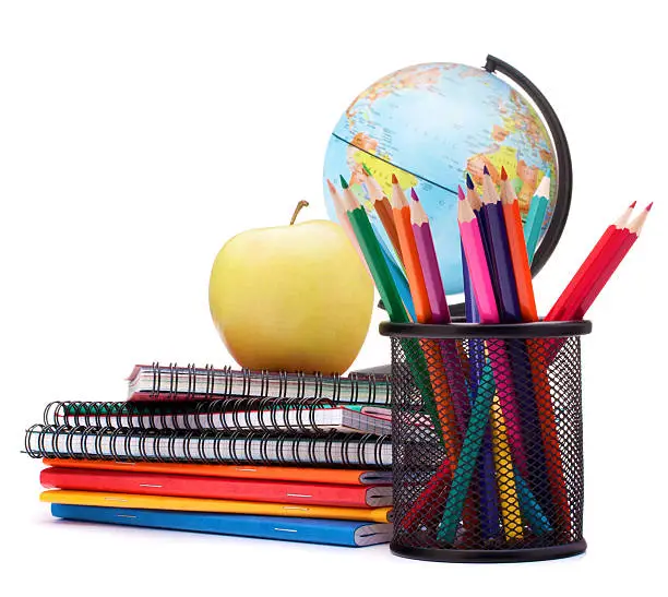 Photo of Globe, notebook stack and pencils
