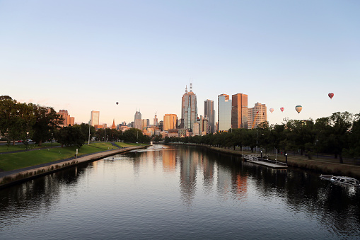 Melbourne City skyline at dawn on the Banks of the Yarra River.