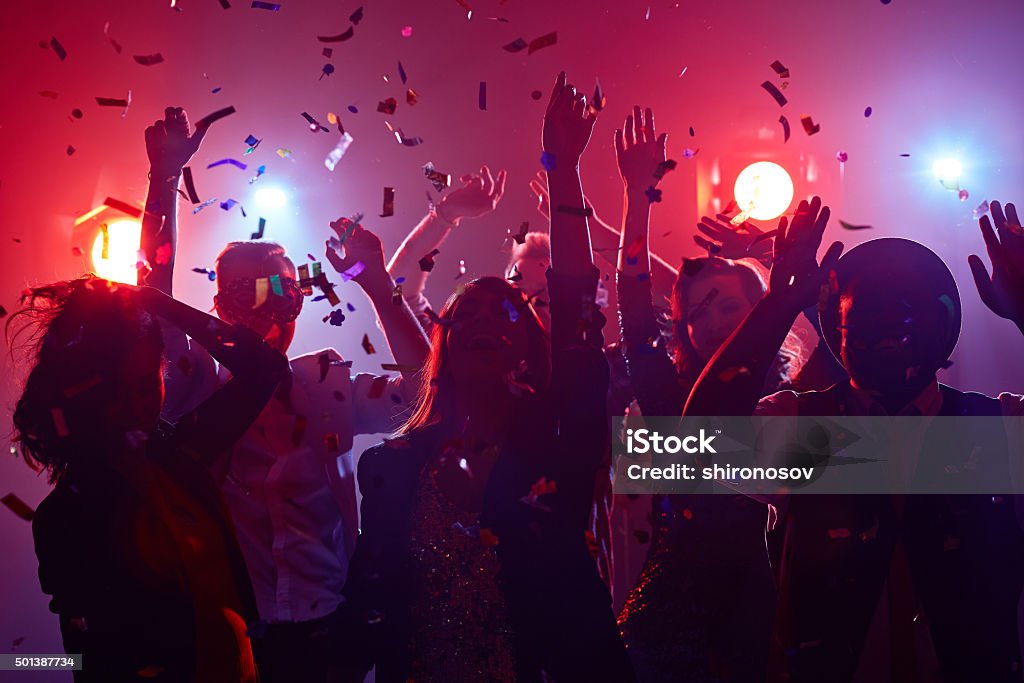Dancing friends Young people dancing in night club Party - Social Event Stock Photo