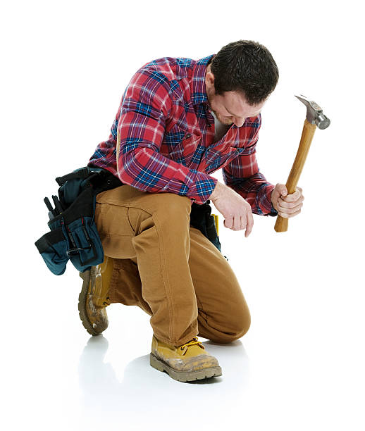 istock Male carpenter working with hammer 501388286