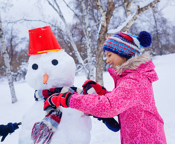 istock Girl plaing in the snow 501388388
