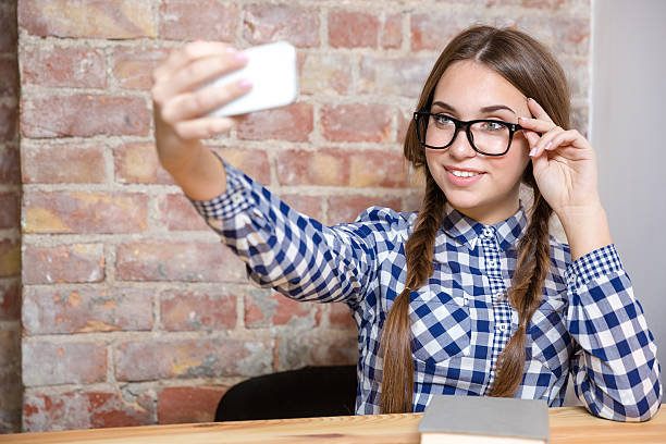 istock Smiling woman making selfie photo 501388638