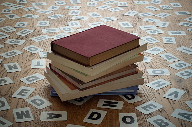 istock Old closed books in a letter cards background 501391654