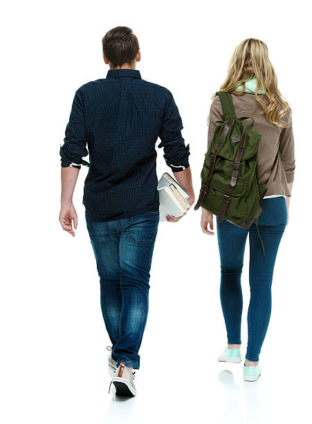 istock Rear view of two students walking 501398594