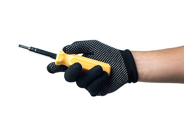 istock Constructor hand in black work gloves holding screwdriver. isolated on 501399774