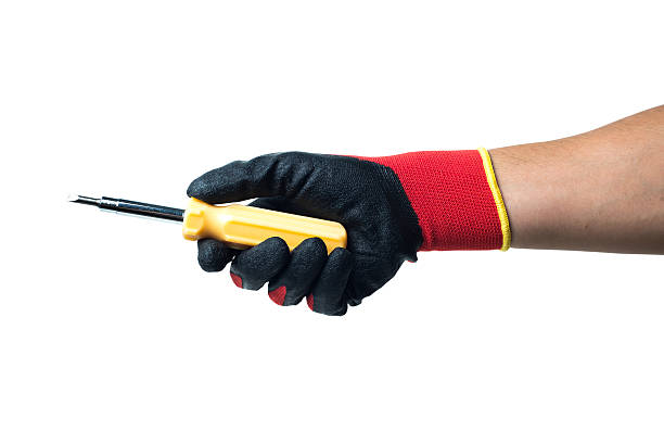 istock Constructor hand in red rubber gloves holding screwdriver. isolated on 501400030