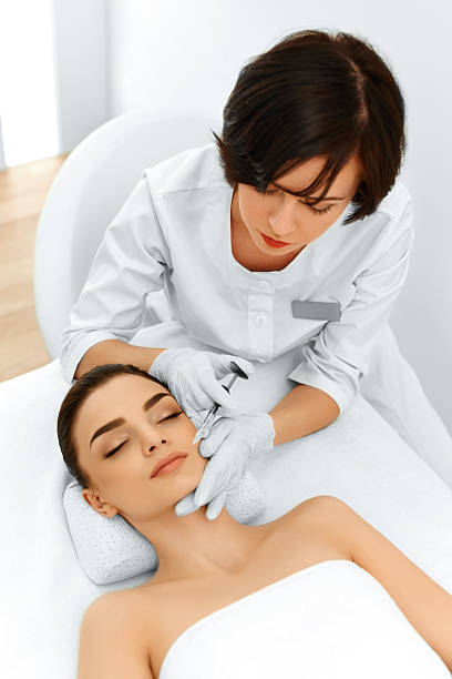 istock Plastic Surgery. Woman Gets Cosmetic Injection. Cosmetology. Bea 501419698