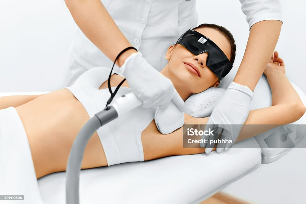 Body Care. Laser Hair Removal. Epilation Treatment. Smooth Skin. Body Care. Underarm Laser Hair Removal. Beautician Removing Hair Of Young Woman's Armpit. Laser Epilation Treatment In Cosmetic Beauty Clinic. Hairless Smooth And Soft Skin. Health And Beauty Concept. Hair Removal Stock Photo