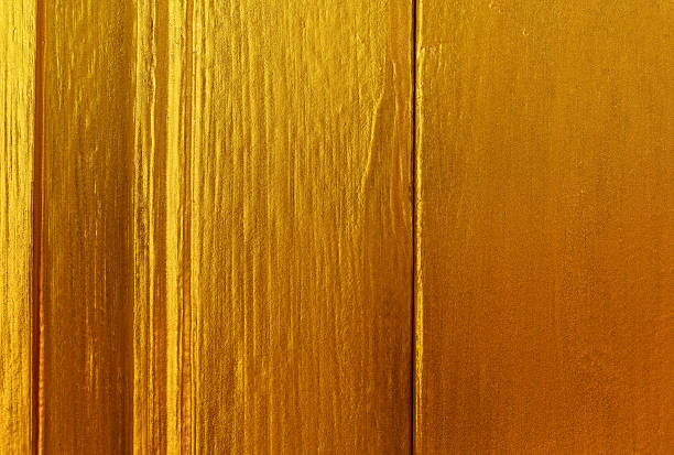 istock wood gold paint background 501422068