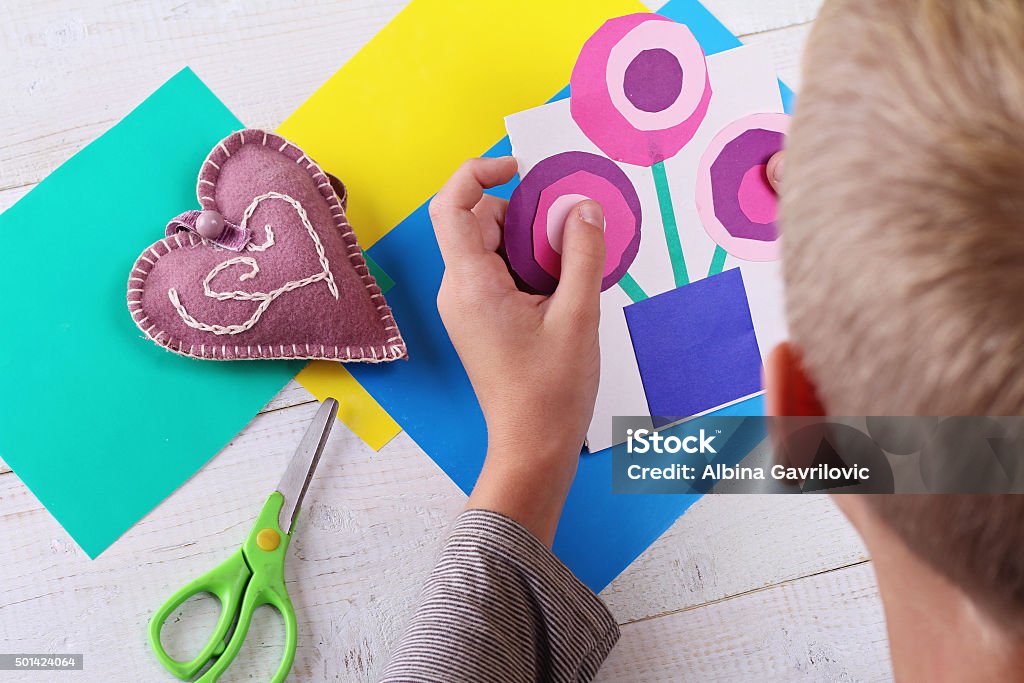 Child cut out of colored paper. Kid making  birthday card. Child cut out of colored paper. Kid making  birthday card. Happy mothers day and happy 8 march. Kids Art, Art Projects, Handmade New Year decorations 2015 Stock Photo