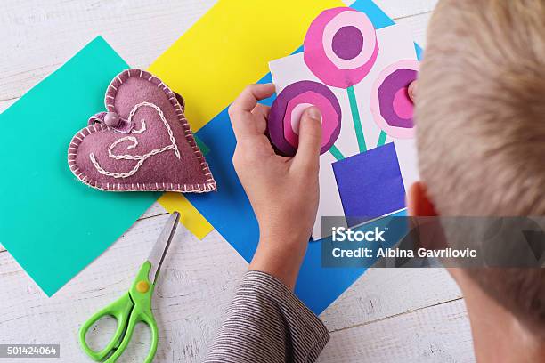 Child Cut Out Of Colored Paper Kid Making Birthday Card Stock Photo - Download Image Now