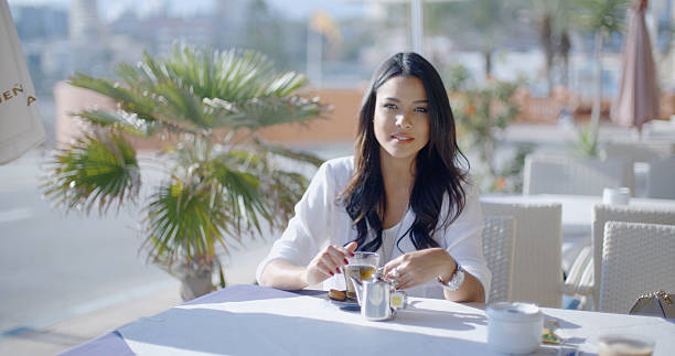 istock Girl Sitting At Cafe With Cup Of Tea 501426178