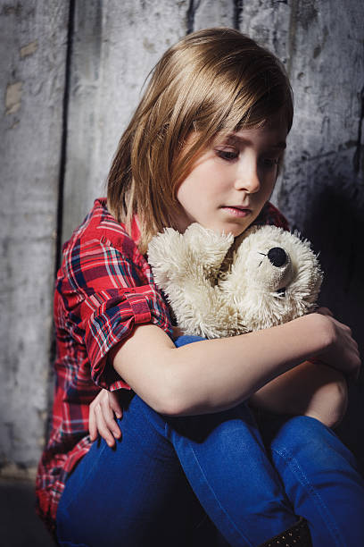 istock Depressed child with toy 501426266