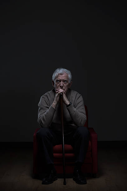 istock Old worried man with cane 501428550