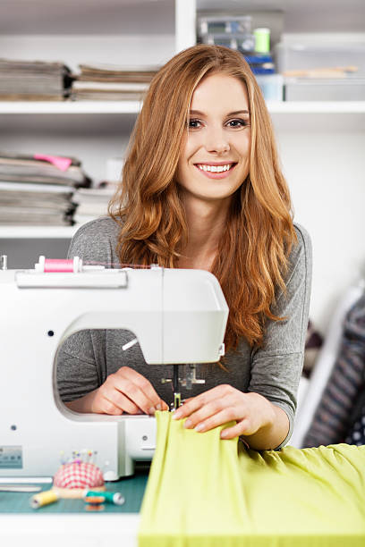 istock Young woman at a sewing machine 501429660