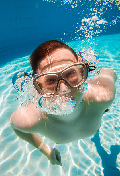 istock teenager floats in pool 501430914