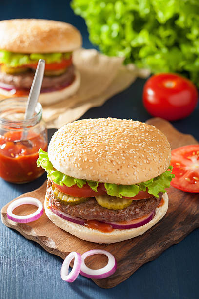 istock burger with beef patty lettuce onion tomato ketchup 501431430