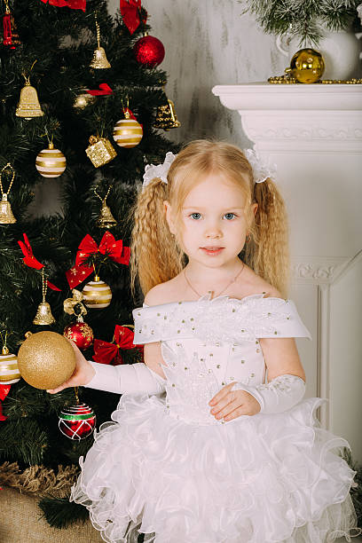 istock Snow little princess holding Christmas ball 501431580