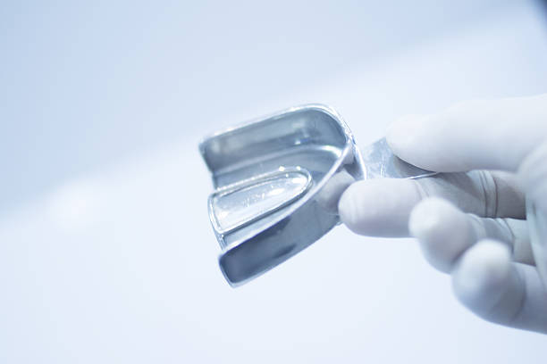 istock Dental mold dentists teeth ceramic plate cast 501432324