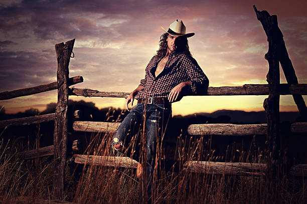 Sexy Country Cowboy In A Western Sunset stock photo