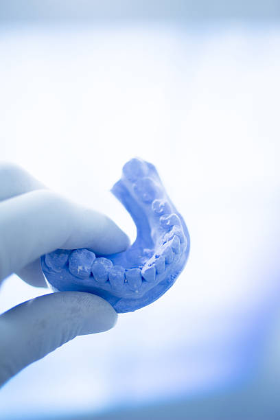 istock Dental mold dentists clay teeth ceramic plate cast 501434088