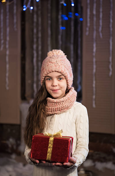 istock girl with christmas gift box 501434500