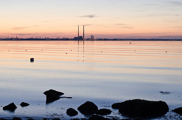 Calm sea of Dublin bay at dusk. stock photo
